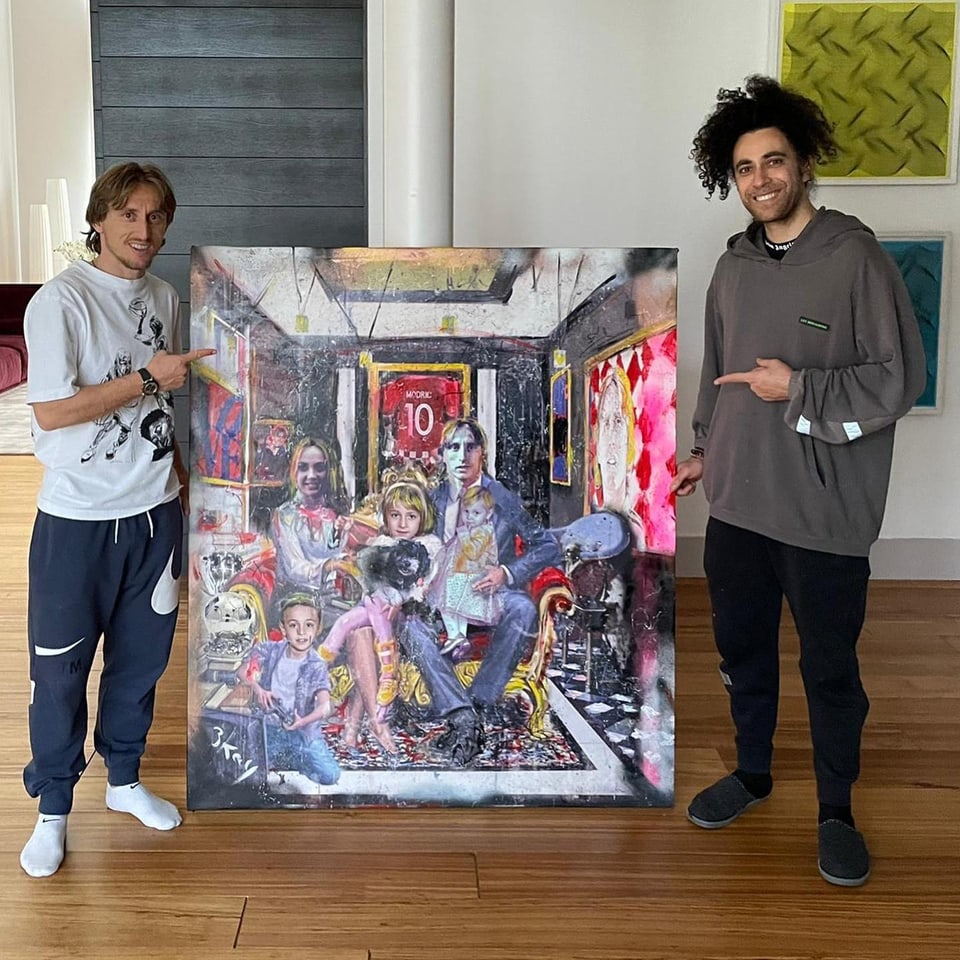 Zwei Männer in der Mitte ein Gemälde