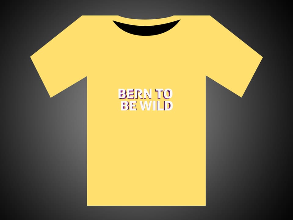 Weisse Schrift auf einem gelben T-Shirt: Bern To Be Wild.