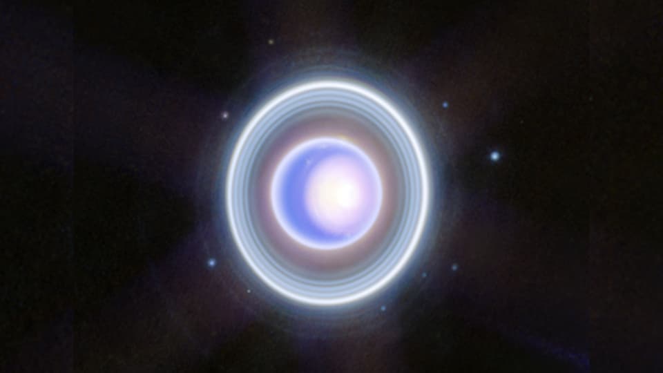 ein blauweisser Planet mit leuchtend weissen ringen RIngen drumherum