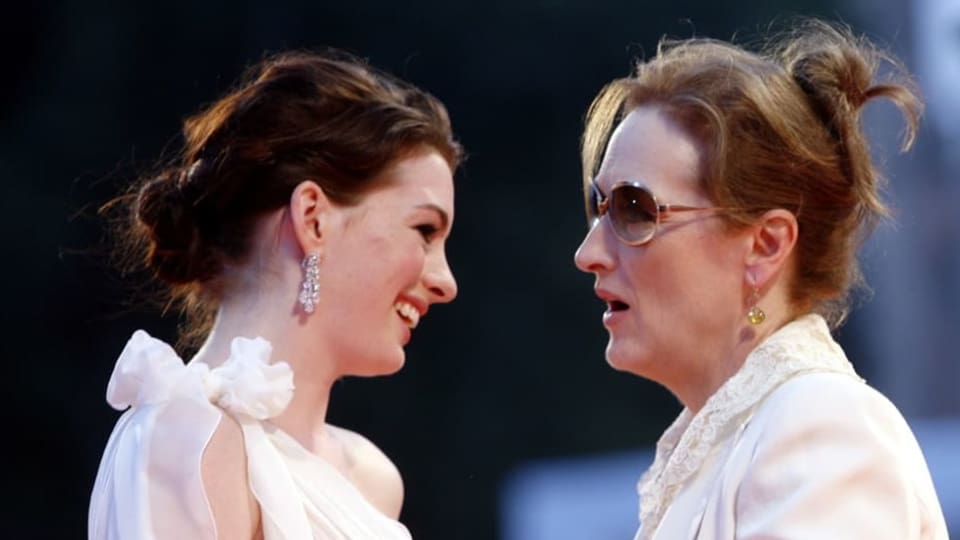 Anne Hathaway and Meryl Streep in a profile shot during the 2006 Venice Film Festival.