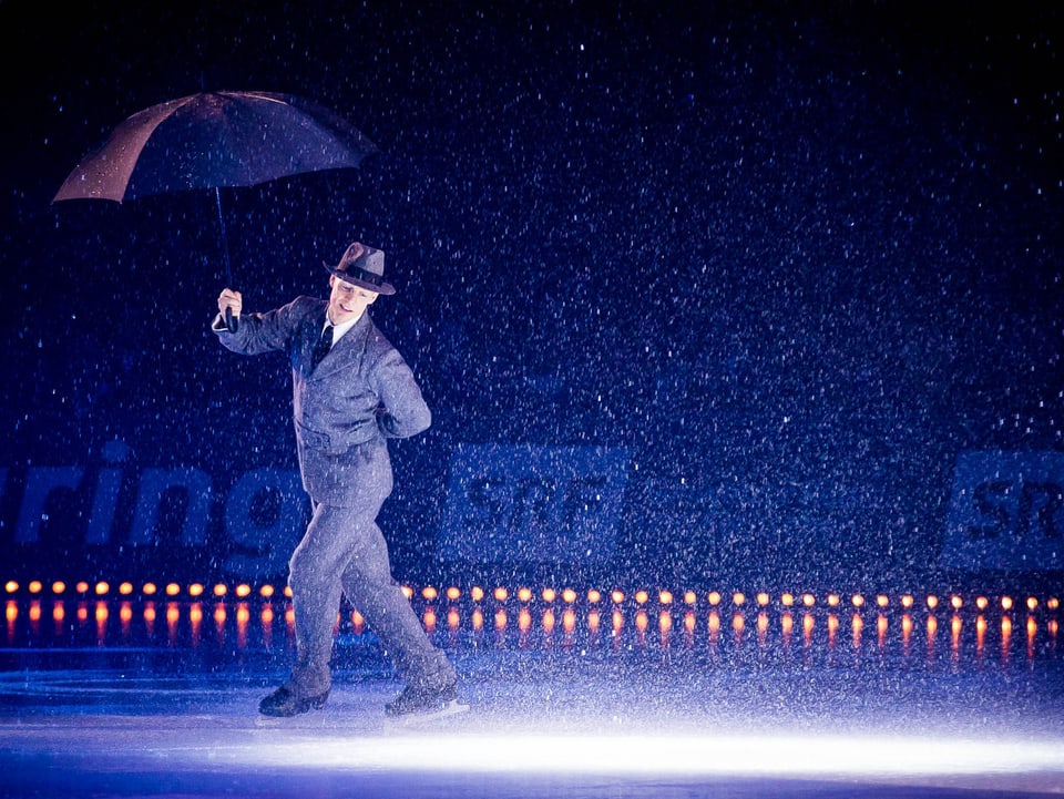 Der Kanadier Kurt Browning mit Regenschirm.