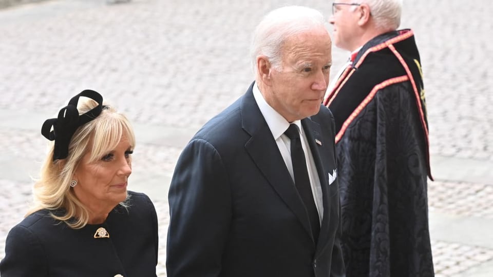 Biden and his wife enter the church.