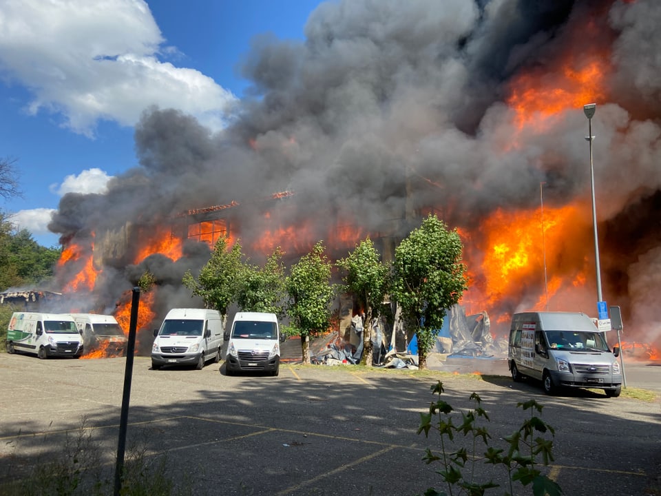 Flames and parked vehicles