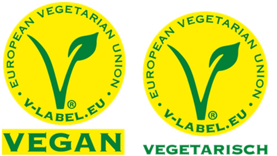 Zwei runde gelbe Labels mit grüner Schrift