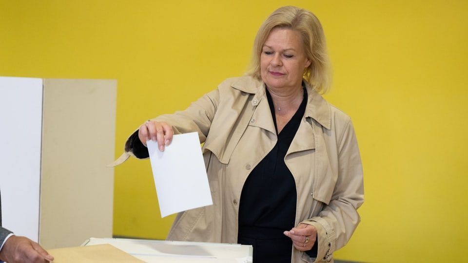 She places an audio envelope in a box.