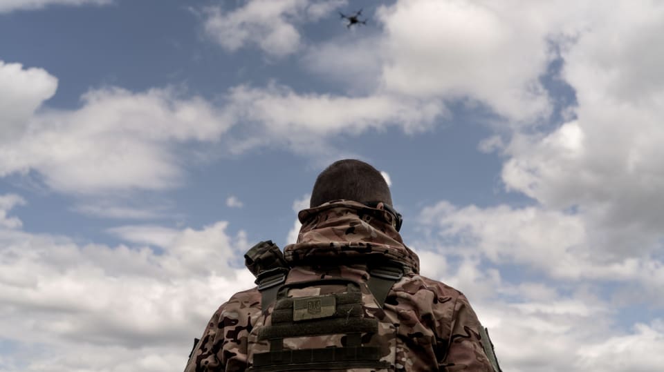 Ukrainian soldier controls the drone