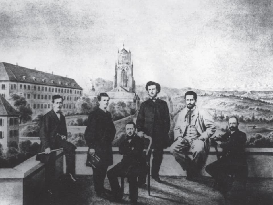 Mehrere Männer auf einem Schwarz-Weiss-Foto.