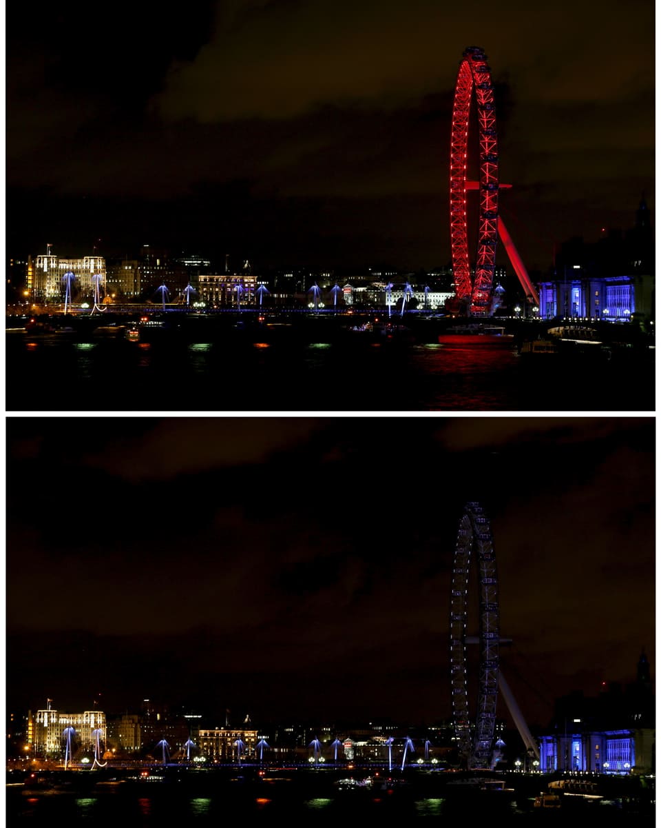 Das London-Eye-Riesenrad in London, oben rot beleuchtet, unten nicht.