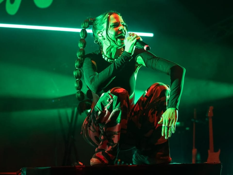 Young star and rapper Nina Chuba poses on stage at the Gurten Festival