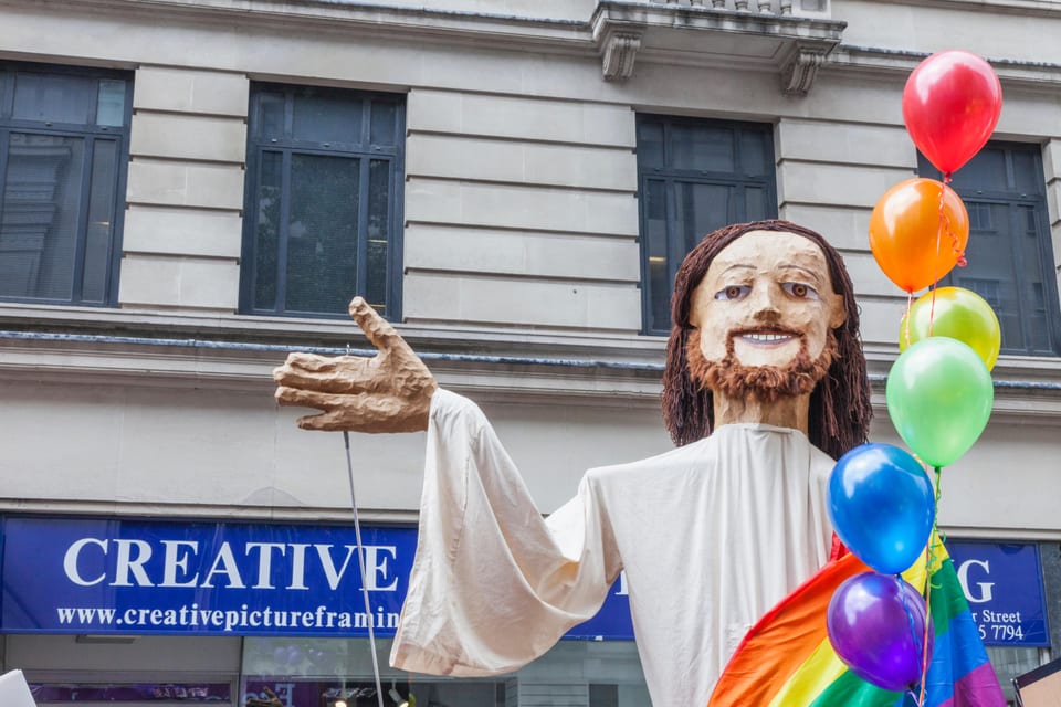 Large Jesus figure with rainbow flag