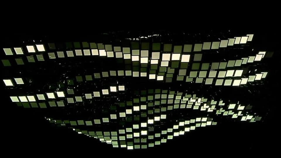 Eine Lichtskulptur aus Oled-Lampen, die in geschwunden Linien angeordnet sind.