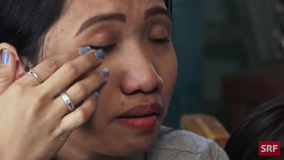 former household slave wipes tears from her eyes