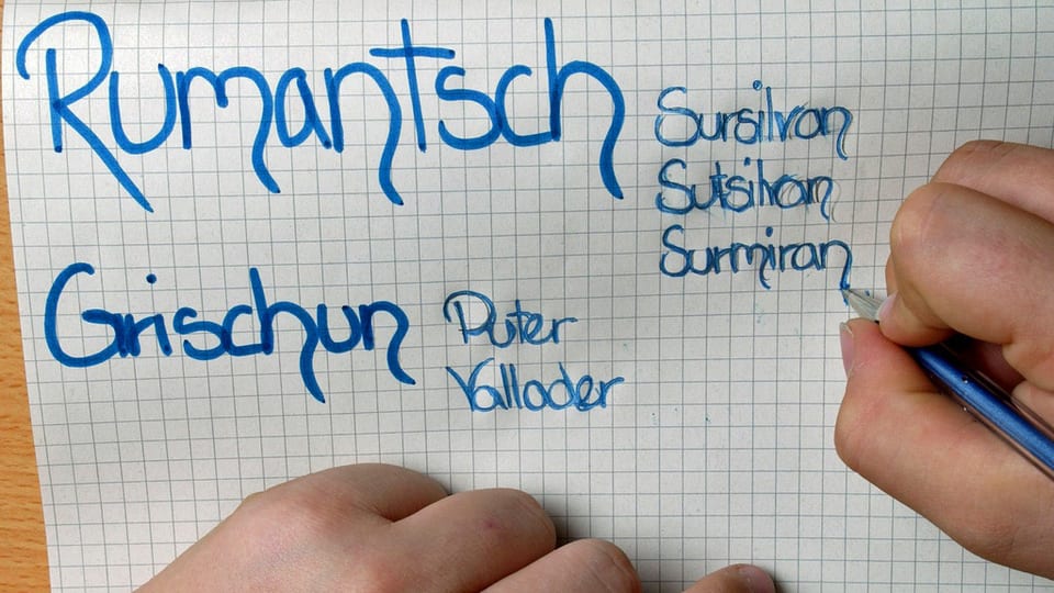 Blatt auf welches ein Schüler «Rumantsch Grischun» geschrieben hat.