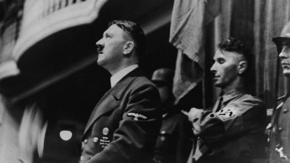 Hitler at the lectern.