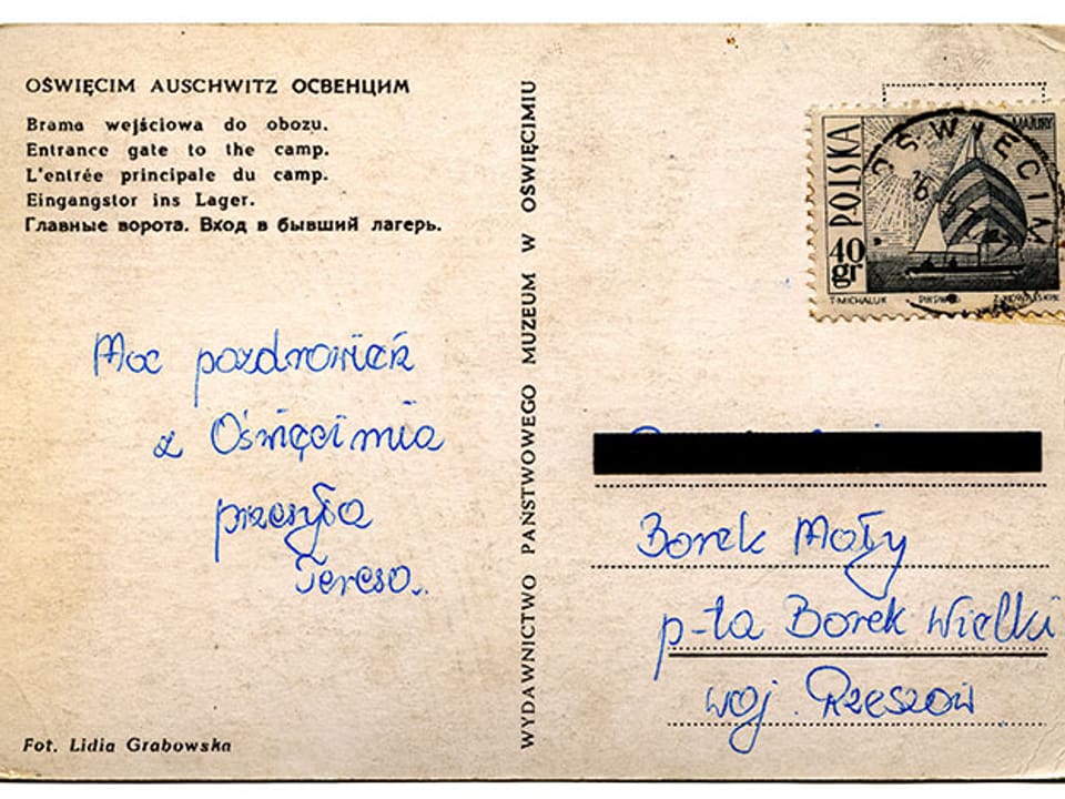 Vergilbte Postkartenrückseite mit einem Gruss auf Polnisch.