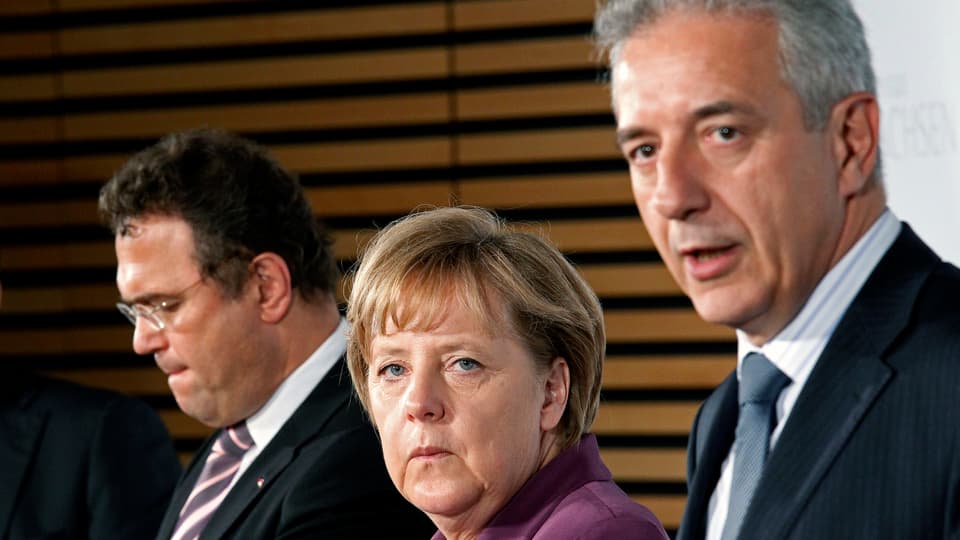 Stanislaw Tillich mit Angela Merkel und Innenminister Hans-Peter Friedrich
