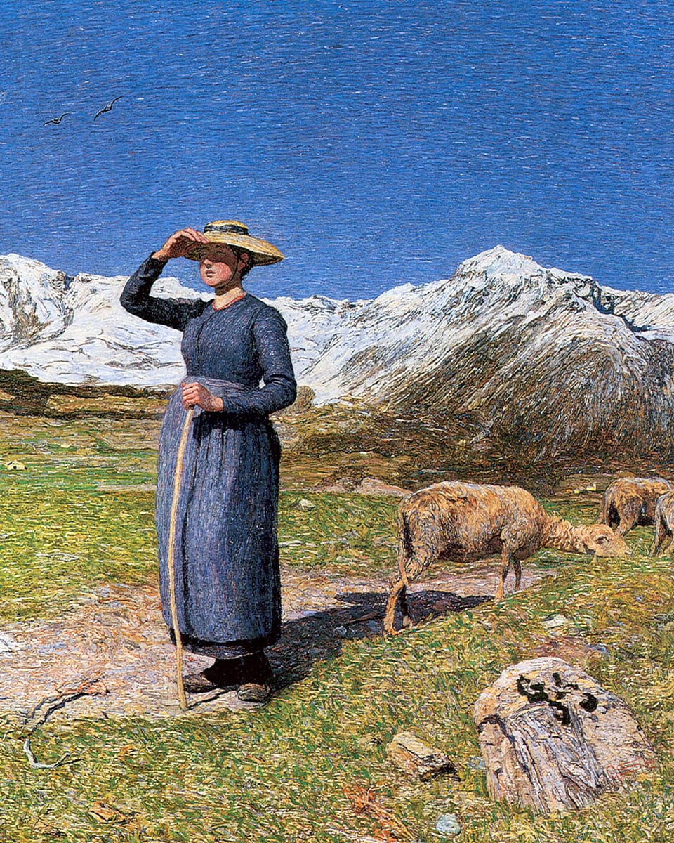 Eine Hirtin mit breitem Hut auf der Weide neben ihren Schafen, in die Weite blickend.