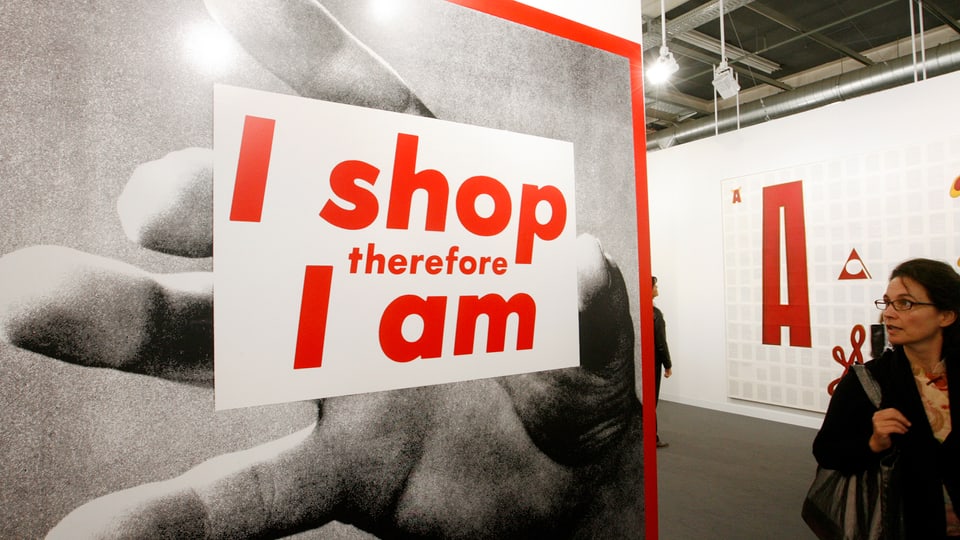 Ein Plakat an der Art Basel mit dem Motto «Ich shoppe, also bin ich».