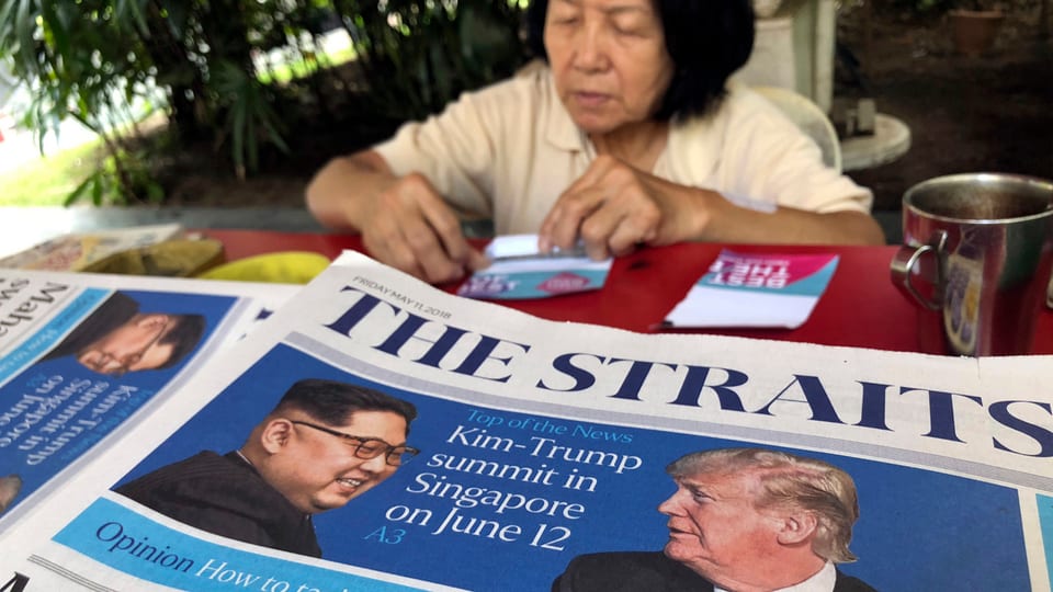 Zeitungsschlagzeile mit Treffen Trump-Kim am 12. Juni.