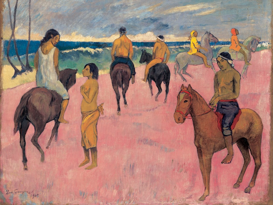 Reiter und Reiterinnen am Strand.