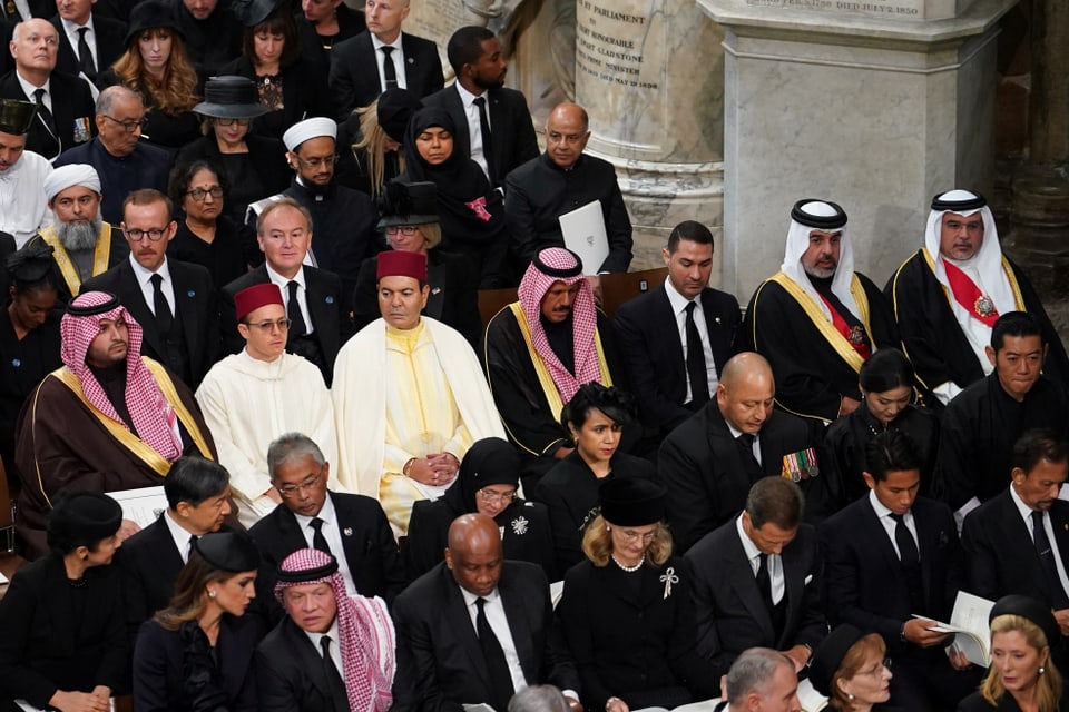 The guests at the funeral in the church. 
