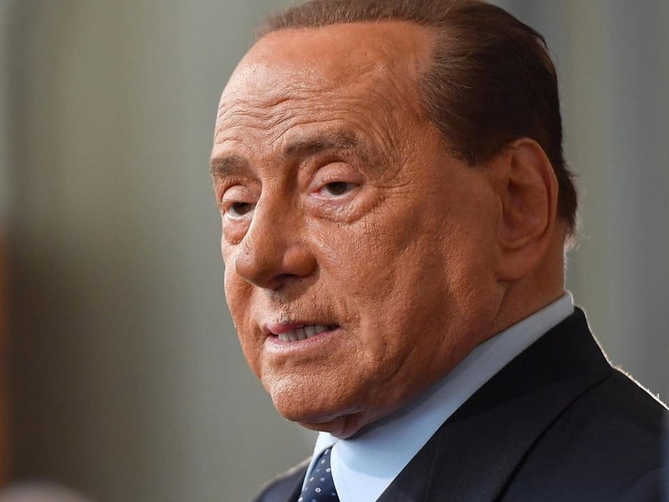 Portrait of Silvio Berlusconi, pictured from the side.