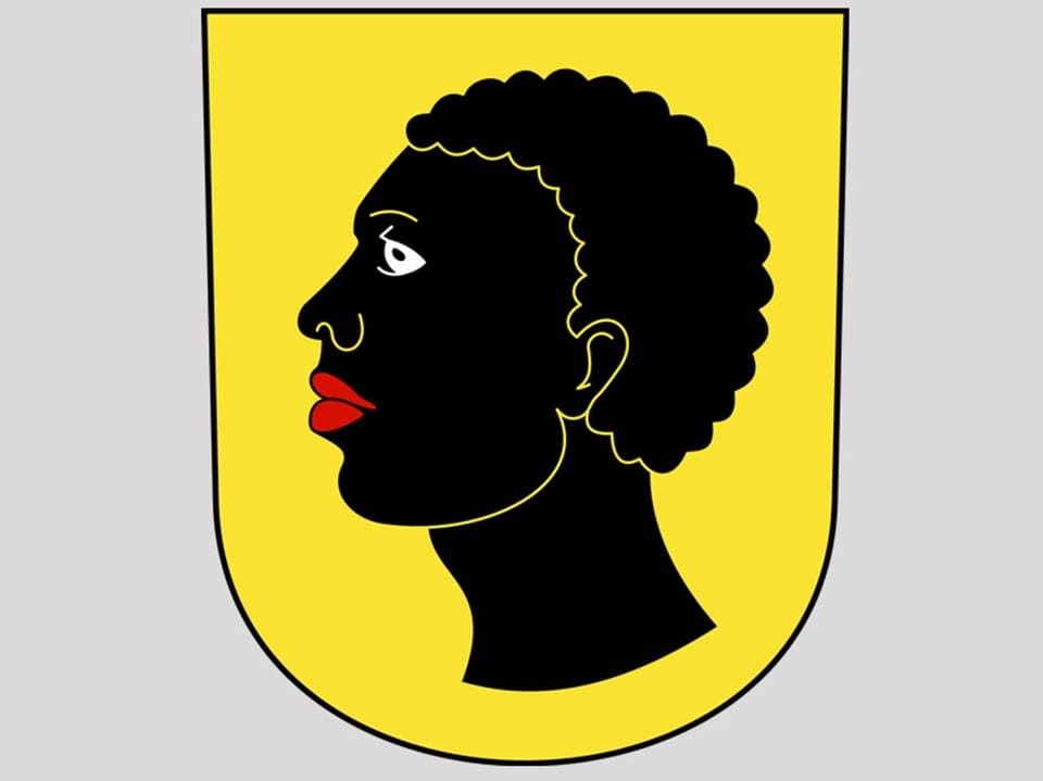 Ein Wappen mit einem dunkelhäutigen Mann auf gelbem Grund. 