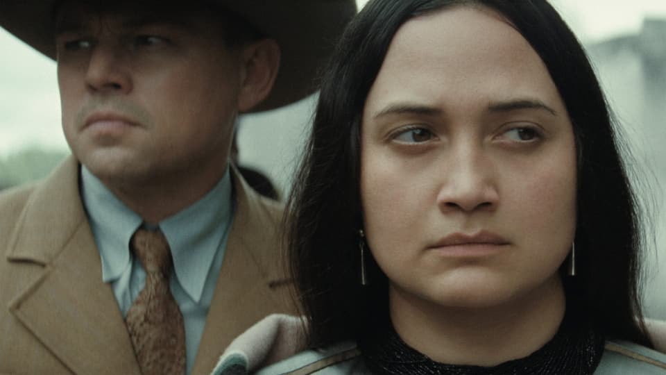 Scenes from a marriage: Leonardo DiCaprio as his husband Ernest looks to the left, his wife Mollie as the betrayed person looks to the right.
