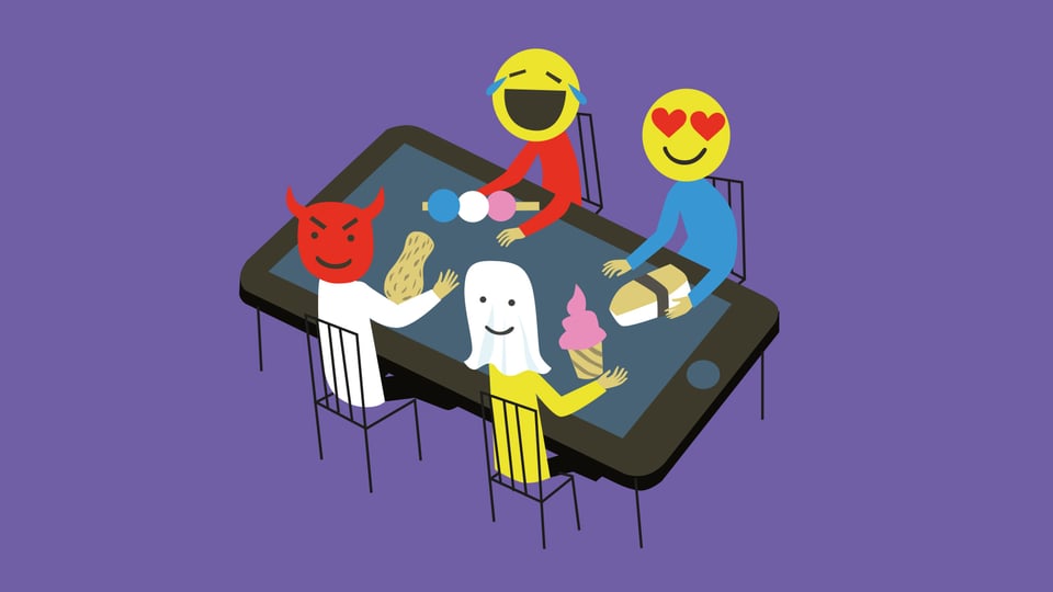 Vier Menschen mit Emoji-Köpfen sitzen um einen Tablet-Tisch.