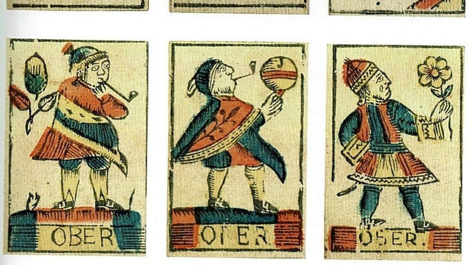 Alte Jasskarten mit verschiedenen Darstellungen des Ober.