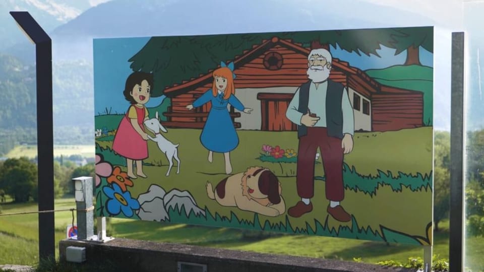 Eine Tafel, auf der Heidi mit dem Alpöhi zu sehen ist.
