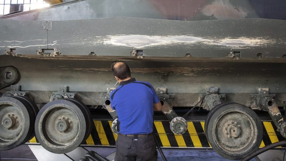 Mechanic working on Schuetzenpanzer 2000 (CV90).