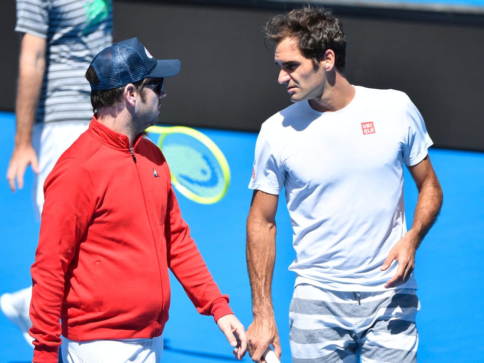 Severin Lüthi (links) und Roger Federer im Training