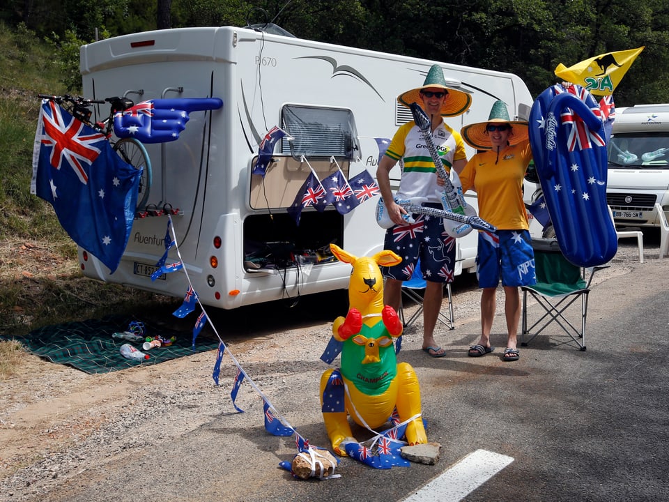 Australian cycling fans pose in front of ther camping van during the 228.5 km fifth stage of the centenary Tour de France cycling race from Cagnes-Sur-Mer to Marseille July 3, 2013. 