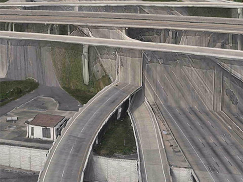 3D-Kartenansicht: Autobahnunterführung, ein Bildfehler lässt eine Strasse aussehen, also würde sie in einer Wand enden.