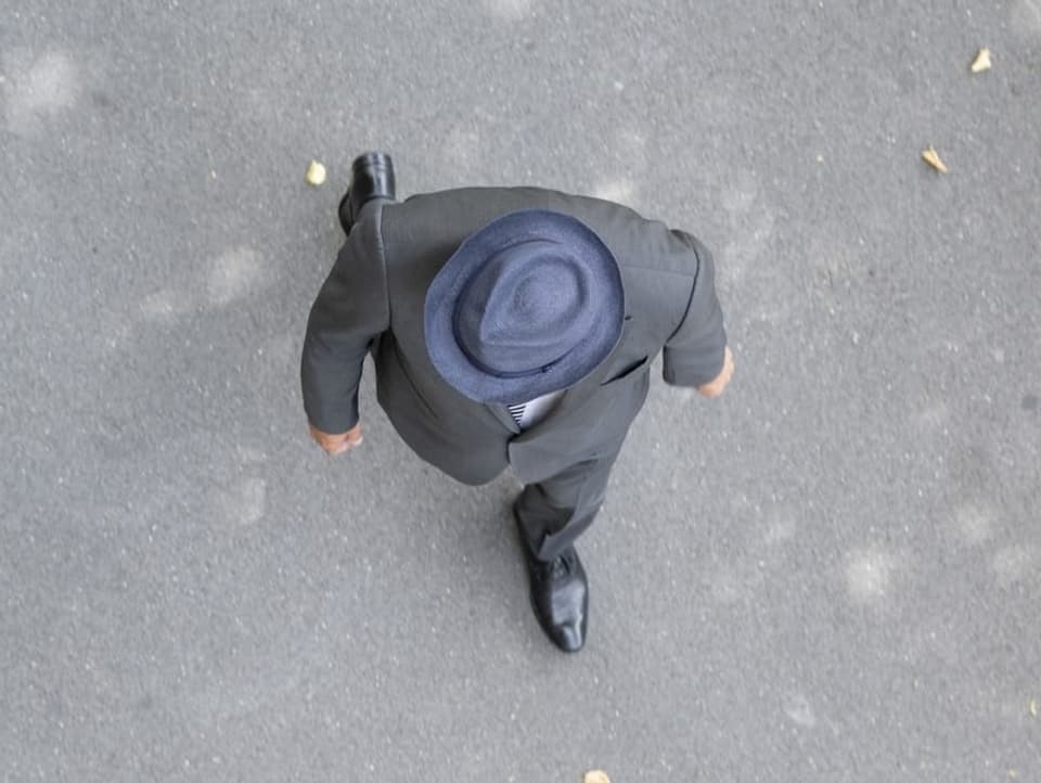 Man wearing hat pictured from above.
