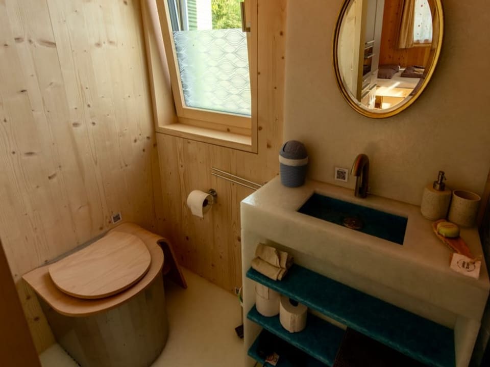 the small toilet in the wooden house