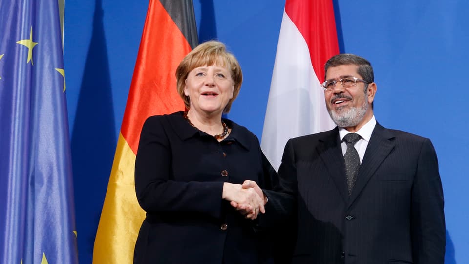 Angela Merkel (l) und Mohammed Mursi