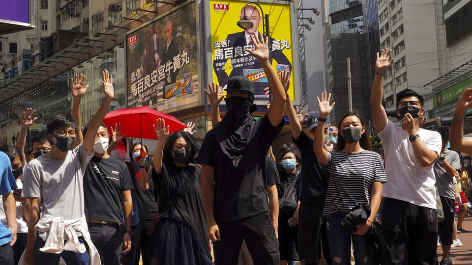 Demonstranten mit Maske in Hongkong