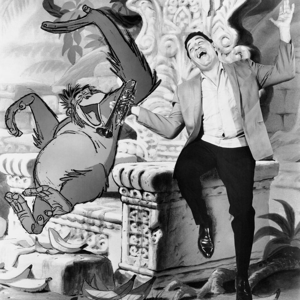 Zeichentrickfilm-Still eines Affen, neben den eine reale Person, ein Mann mit Trompete in der Hand, eingesetzt ist.