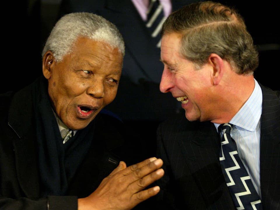 Mandela mit Prinz Charles (rechts)