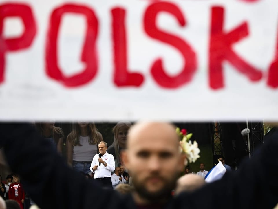 Man holding a Poland sign