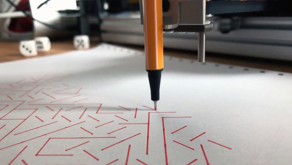 Ein Stift zeichnet Striche. 