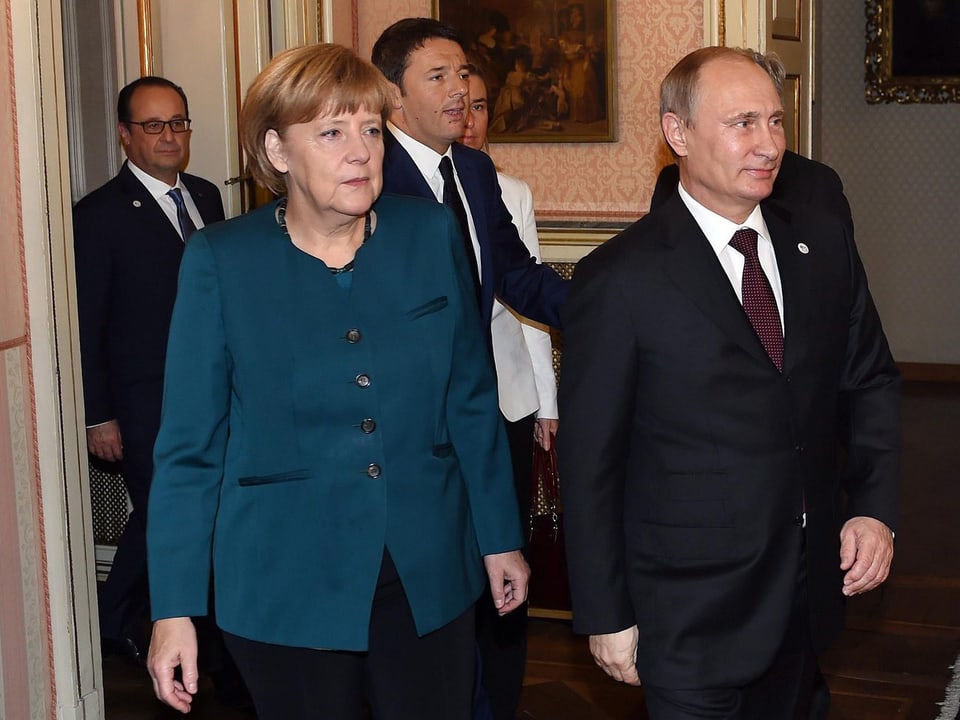 Putin und Merkel am ASAM-Gipfel in Mailand.