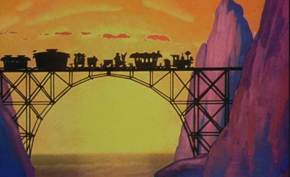 Eine Lokomotive fährt in den Sonnenuntergang.