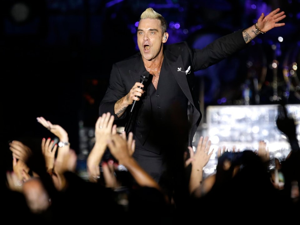 Robbie Williams bei einem Konzert