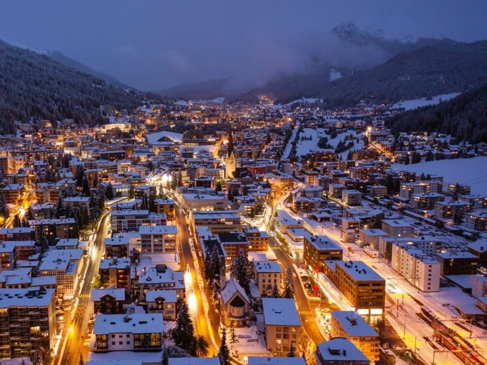 City with snow at night with lights