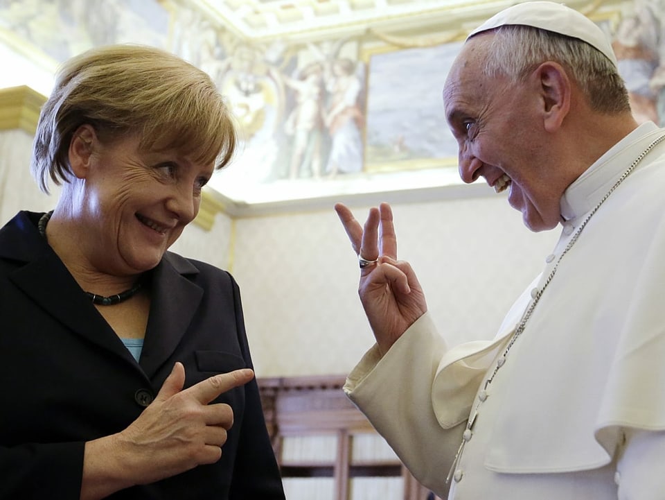 Merkel und Franziskus.