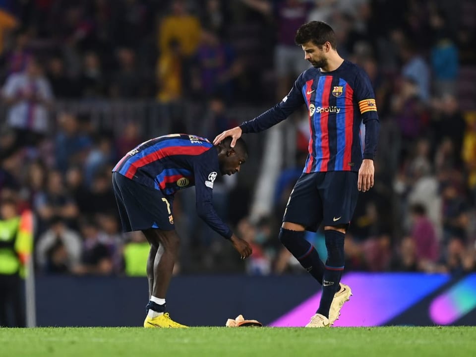 Ousmane Dembélé und Gerard Piqué.