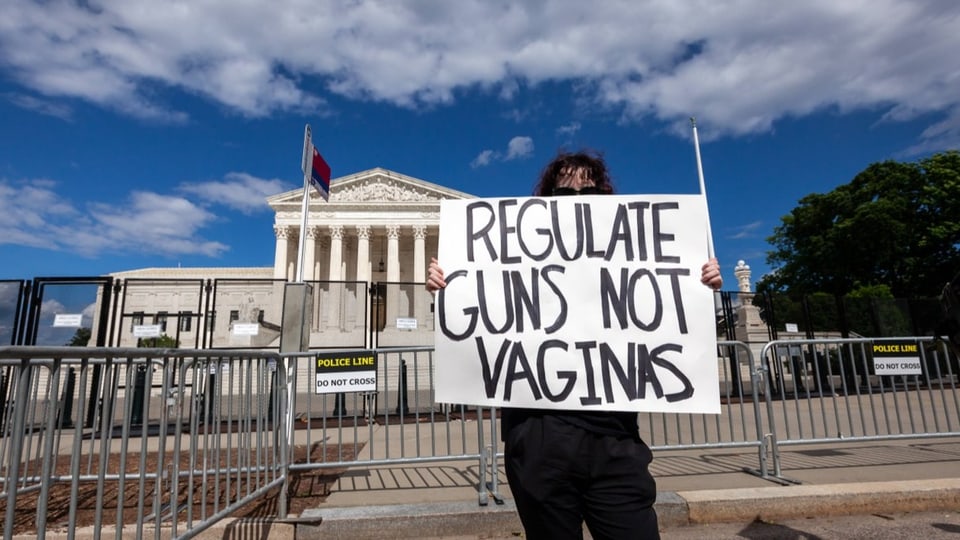 Gun laws in the united states - supreme court largely expanded the right to carry guns Man with shield.